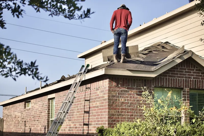 Professional roofer working on a residential roof in Pecan Ridge